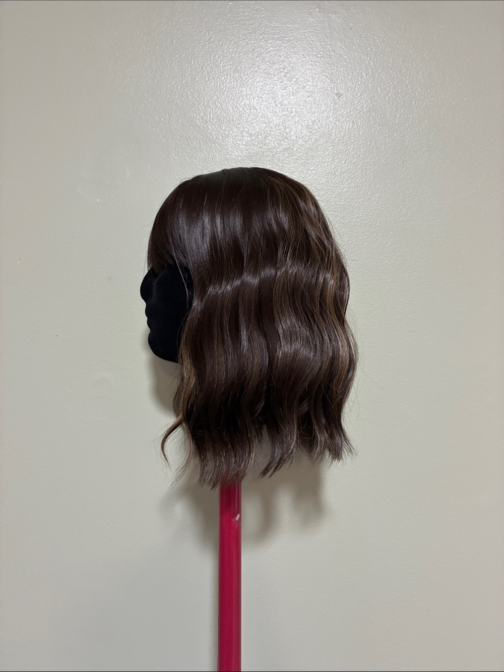 Brown synthetic wig with blonde highlights